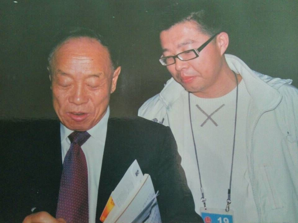 周明國與原外交部長李肇星（左）