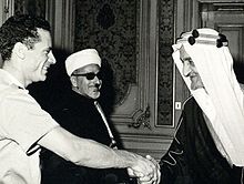 1970年代早期會見卡扎菲（左）