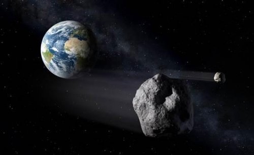 模擬圖：小行星經過地球時的畫面